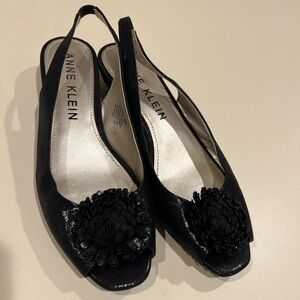 Anne Klein Black Slingback Peep-Toe Flats with Floral Pom Accent